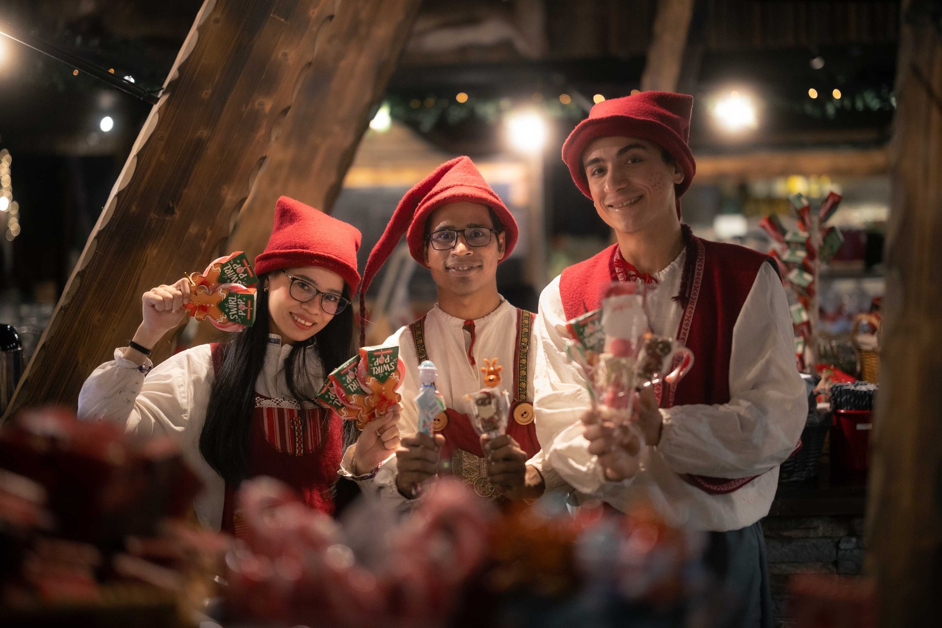 Elves with sweets in SantaPark’s cavern