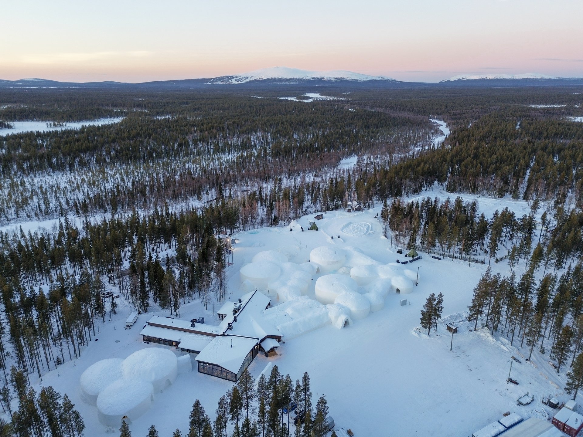 Lapland Hotels SnowVillage’s domes of snow in the forest at Lainio, from the air